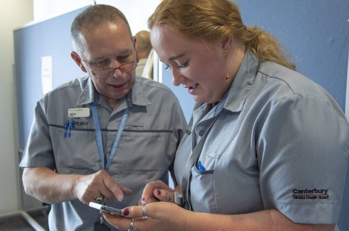 Orderlies Kim and Spencer make use of Canterbury DHB’s new orderly service app