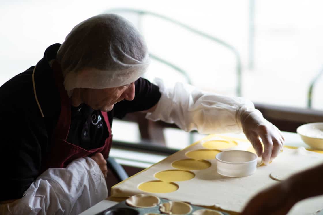 Tommy preparing mince pies for a customer order.